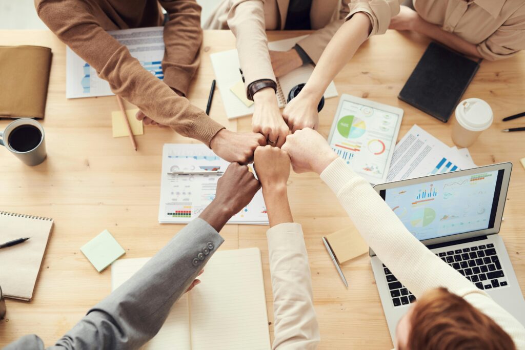pexels-photo-3184438-3184438 Photo Of People Having Fist Bump